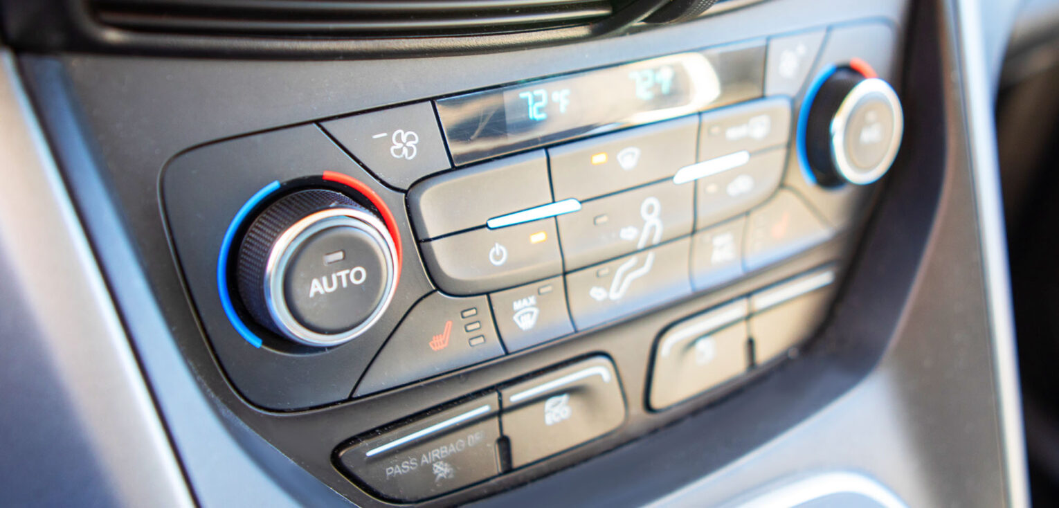 Photo of heater and climate controls on a car dashboard
