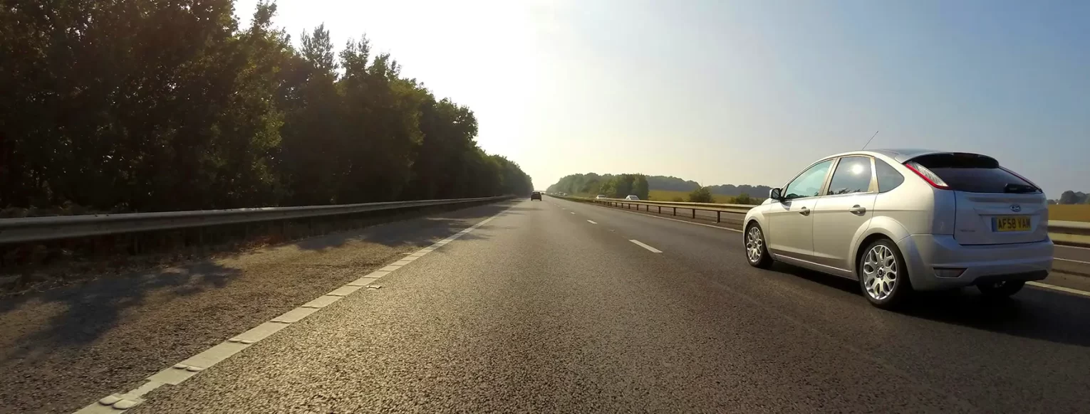 A car driving on a highway