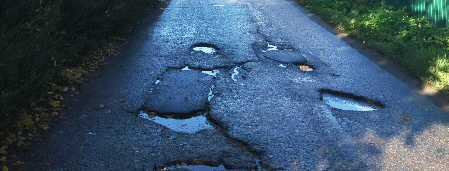 Potholes on a road